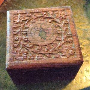 Hand carved wooden box. Great for jewelry or decoration. Has leaves and flowers